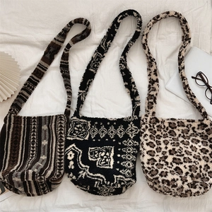 Detailed flat lay of plush shoulder bags in leopard print, stripes, and ethnic patterns