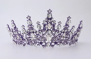 Macro detail of royal purple tiara featuring elegant crystal rhinestones and metal frame