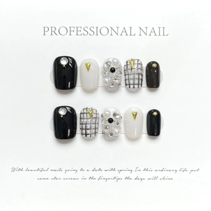 Handmade press-on nails with luxury black and white pearls, chains, and tweed patterns