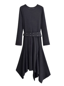 Detail of black long sleeve dress featuring waist belt with metal eyelets and textured fabric