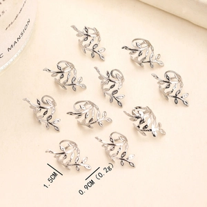 Detail view of 10-piece silver leaf dreadlock charms with intricate hollow vein textures