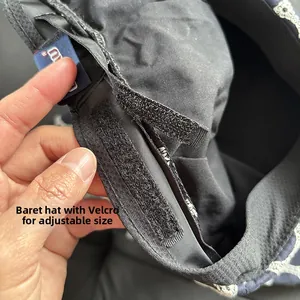 Detail view of the inner velcro strap for size adjustment on the embroidered beret
