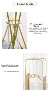 Close-up of a gold metal frame with Love text and a removable glass tube vase