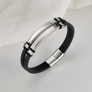 Men's double-layer black leather bracelet with polished silver metal plate on white fabric