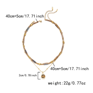 Double-layered gold chain necklace with tiger eye stone pendant and product dimensions