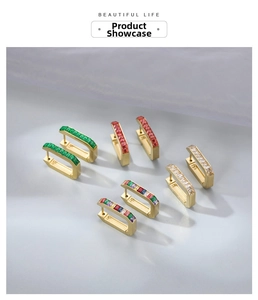 Detailed view of U-shaped gold earrings with colorful square-cut zircon stones