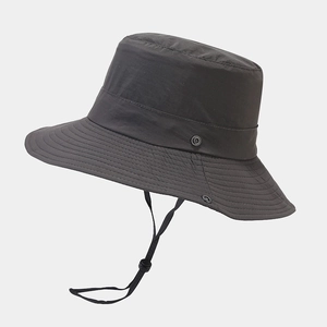 Detail of dark grey sun hat with adjustable windproof cord and side metal snaps