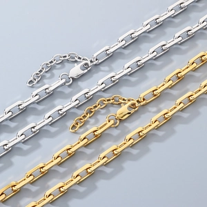Detail of silver and gold paperclip chain link necklaces with lobster clasp closure