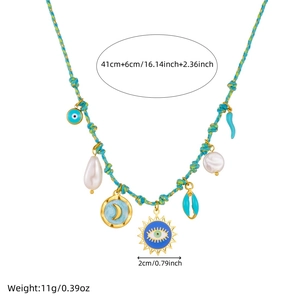 Blue cord necklace with gold sun, moon, and devil eye charms for women