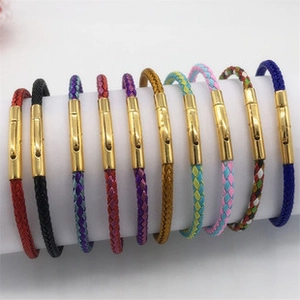 Close-up of adjustable woven cord bracelets with golden magnetic clasps on display