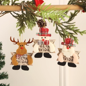 Plush Christmas tree ornaments with reindeer and snowman featuring Feliz Navidad wooden signs