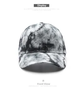 Detailed front view of a black and white tie-dye cotton baseball cap with six-panel design