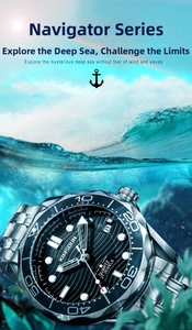 Macro shot of waterproof diving watch with steel strap submerged in clear blue water