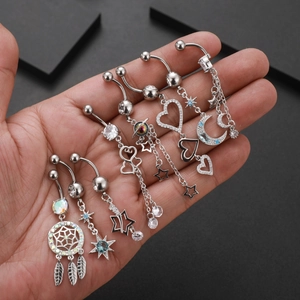 Set of seven silver navel rings featuring dreamcatcher and star zircon details