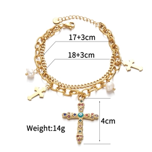 Close-up of double layer gold cross and pearl necklace with size and weight details