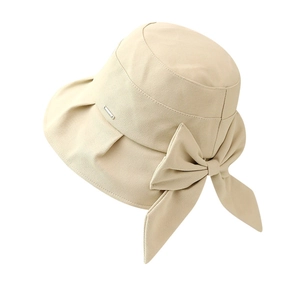 Beige wide-brim sun hat with large bow and metal plaque, breathable cotton blend fabric