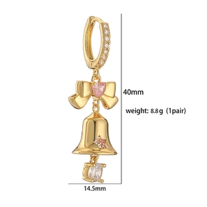 Detail view of a Christmas bell earring with pink and orange zircons including dimensions