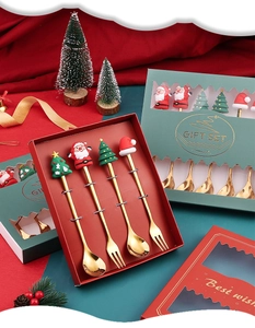 Christmas gift box with gold stainless steel spoons, forks and festive resin ornaments