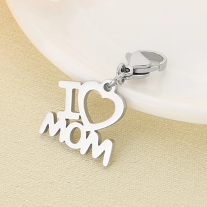 Silver MOM heart pendant keychain detail with lobster clasp on a white ceramic edge