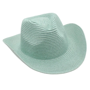 Detail of mint green straw cowboy hat featuring fine woven texture and rolled brim style