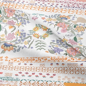 Close-up of bohemian floral tapestry fabric with intricate mandala patterns and soft texture