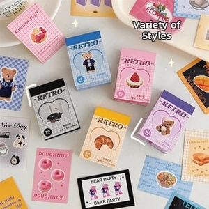 Detailed view of various retro-style cartoon stickers with dessert and bear motifs