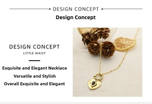 Detail of 18K gold plated heart pendant with textured finish and dark gemstone inlay