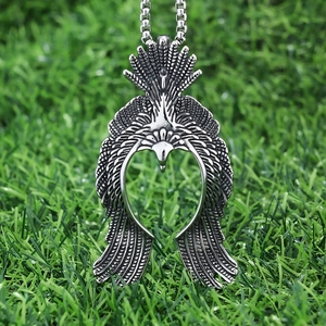 Detailed view of flying eagle pendant in vintage stainless steel on beaded chain