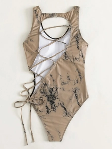 Detail of marble print one-piece swimsuit with sexy side lace-up ties and cut-outs