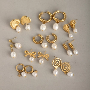 Variety of 18k gold plated stainless steel pearl earrings with ginkgo leaf designs