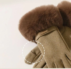 Detailed view of women's warm gloves with faux fur trim and touch screen fingertips
