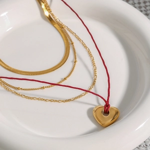 Four-layer 18K gold stainless steel necklace with red cord and gold heart pendant