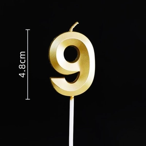 Macro shot of gold number 9 birthday candle with matte finish, 4.8cm height detail