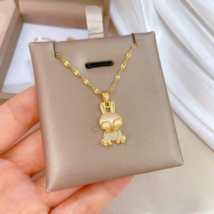 Luxury gold titanium steel necklace featuring a crystal-encrusted bunny with cat eye stone