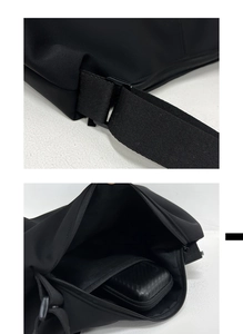 Detail of adjustable strap and spacious interior of a minimalist black crossbody bag