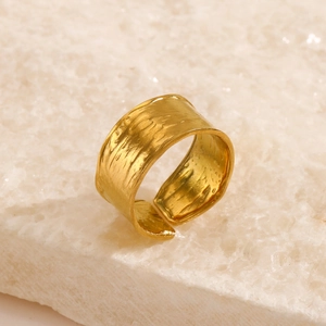 Adjustable wide gold-plated stainless steel ring with rustic hammered rock texture