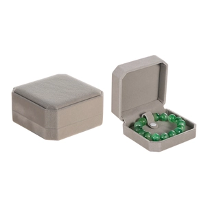 Detailed view of an octagonal grey velvet jewelry box for bracelets and bangles