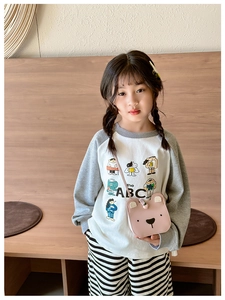 Detail of pink cartoon bear crossbody bag for kids featuring adjustable shoulder strap