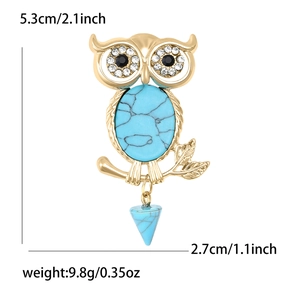 Vintage owl brooch in gold metal with turquoise stone and rhinestone eyes detail