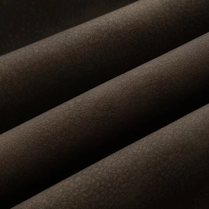 Detail of dark coffee PU fabric showing vintage texture and durable material quality