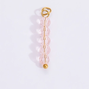 Macro shot of 18k gold plated pink crystal beaded pendant charm for DIY jewelry