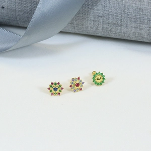 Detailed view of 925 silver flower stud earrings with vibrant blue, red, and green gemstones