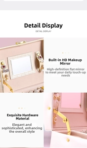 Detail view of pink crocodile leather jewelry box with makeup mirror and metal support