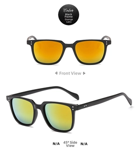 Detail view of square black frames with orange mirrored lenses and metal rivets