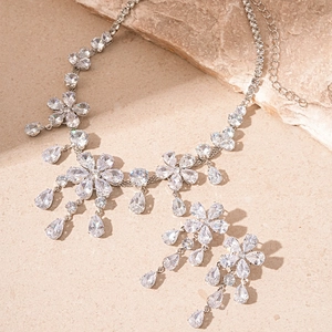 Luxurious flower drop necklace and earrings set with sparkling zircon in silver tone