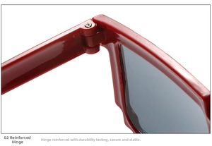 Detailed close-up of the reinforced metal hinge structure on red mosaic party sunglasses