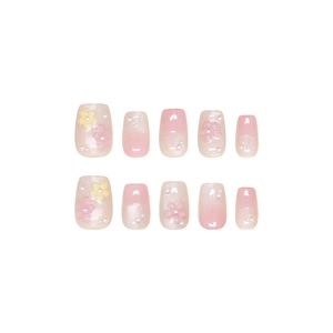 Pink and pearl white gradient press-on nails with 3D floral accents and mini pearls