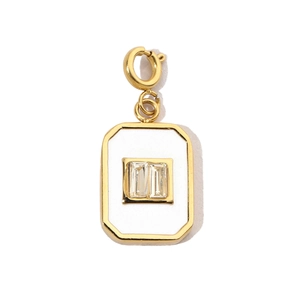Detail of gold octagonal pendant with white enamel and dual rectangular zircons