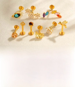 Detailed set of 1.2mm titanium labret studs with colorful cubic zirconia in gold and silver