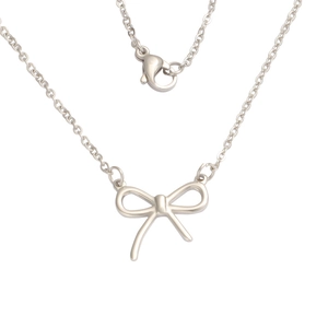 Detailed view of silver bow-knot pendant necklace with lobster clasp on white background